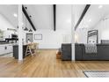 Stylish open-concept living space with modern decor, vaulted ceilings, and an eat-in kitchen at 1202 Anderson St, Deltona, FL 32725