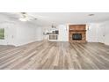 Spacious living room featuring wood flooring and a fireplace at 1534 Center St, Deland, FL 32720