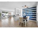 Inviting dining area with decorative shelving and an open concept leading to the living spaces at 1613 Lady Fern Trl, Deland, FL 32720