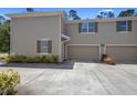 Spacious home features a two-car garage and a well-kept lawn at 1655 Pham Dr, Port Orange, FL 32129