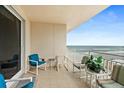 Enjoy ocean views from this condo's private balcony with comfortable seating at 2071 S Atlantic Ave # 705, Daytona Beach, FL 32118