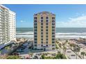 Gorgeous condo building featuring tan and yellow facade and wonderful ocean view at 2071 S Atlantic Ave # 705, Daytona Beach, FL 32118