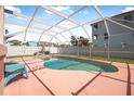 Enclosed backyard pool area, perfect for relaxation and recreation, featuring lounge chairs and patio space at 3817 Islamorada Dr, Ormond Beach, FL 32176