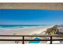 Breathtaking ocean views from the balcony overlooking the beach and pool area at 3855 S Atlantic Ave # 405, Daytona Beach, FL 32118
