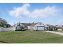 Charming single-story home with a well-maintained lawn and a two-car garage at 417 Jeffers St, Deltona, FL 32725