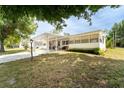 Attractive home with a covered carport, showcasing neat landscaping and a welcoming atmosphere at 44 Florence Blvd, Debary, FL 32713