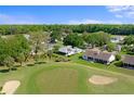 Beautiful aerial view of a golf course community with mature trees and well-maintained lawns at 5097 Nw 19Th Pl, Ocala, FL 34482