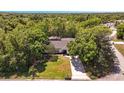 Bird's eye view of a home nestled among mature trees, showcasing its expansive and secluded property at 639 Elwood St, Deltona, FL 32725