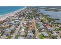 An aerial view shows this home near the ocean and inter-coastal waterway at 101 Egret Ave, Port Orange, FL 32127