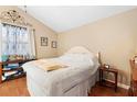 Bright bedroom with a vaulted ceiling, light walls, and cozy furniture at 1135 5Th St, Orange City, FL 32763