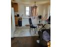 Kitchen with basic appliances, including a refrigerator, freezer, and table at 1228 S Parsons Ave, Deland, FL 32720