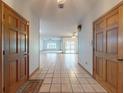 Inviting entryway with tiled flooring, two doors, and views into the living spaces at 1371 Merrifield Ct, Deltona, FL 32725