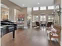 Bright and airy living room featuring hardwood floors and high ceilings filled with natural light at 1420 Shady Meadow Ln, Deland, FL 32724