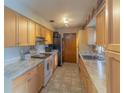 A well-lit kitchen featuring light wood cabinets and durable marble countertops at 2333 Fern Palm Dr, Edgewater, FL 32141