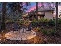 Scenic backyard with seating area, lush greenery, and inviting outdoor space at 2628 Spruce Creek Blvd, Port Orange, FL 32128