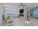 Living room featuring ocean views, an electric fireplace, and sliding blue barn doors into the dining area at 2800 N Atlantic Ave # 1715, Daytona Beach, FL 32118