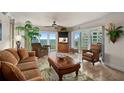 Comfortable living room featuring ocean views, a ceiling fan, and stylish furnishings at 2937 S Atlantic Ave # 1907, Daytona Beach Shores, FL 32118