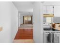 Bright interior view showcasing the hallway leading to the living room at 3 Fairway Ct, Deland, FL 32724