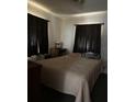 Bedroom with a comfortable bed, side table, and minimal decor at 326 South St, De Leon Springs, FL 32130