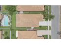 Aerial view of a well-maintained house with a tidy yard and neighboring properties nearby at 3451 Luna Bella Ln, New Smyrna Beach, FL 32168