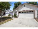 This charming single-Gathering home boasts a spacious two-car garage and a driveway with ample space at 357 Heritage Estates Ln, Deland, FL 32720