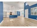 Open-concept kitchen with white cabinets, stainless steel appliances, and a large island for cooking and entertaining at 484 Landshark Blvd, Daytona Beach, FL 32124
