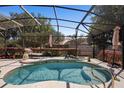 Cozy screened-in pool with lounge chair, perfect for relaxation and outdoor enjoyment at 585 Summerhaven Dr, Debary, FL 32713
