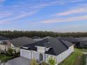 Wide aerial view of a single-story home in a quiet neighborhood at 633 Mosaic Blvd, Daytona Beach, FL 32124