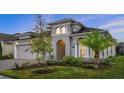 Attractive single-story home with manicured lawn and lush landscaping at 633 Mosaic Blvd, Daytona Beach, FL 32124