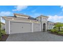 Spacious three-car garage and paver driveway, offering ample parking at 633 Mosaic Blvd, Daytona Beach, FL 32124