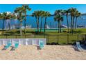 Community area with lounge chairs, grassy area, and water views at 719 S Beach St # 302B, Daytona Beach, FL 32114