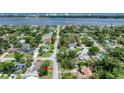 Scenic aerial view of a residential street, highlighting the home's proximity to the waterfront and green spaces at 952 Northbrook Dr, Ormond Beach, FL 32174