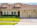 Well maintained single Gathering home featuring a red tile roof, manicured lawn, and a one-car garage at 1079 Quaker Ridge Ln, Davenport, FL 33896