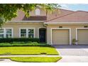 Well maintained single Gathering home featuring a red tile roof, manicured lawn, and a one-car garage at 1079 Quaker Ridge Ln, Davenport, FL 33896