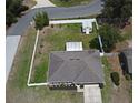 A high aerial view showcasing a large backyard and full roof of the house at 116 Neal Dr, Deltona, FL 32738