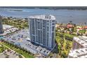Exterior showcases a high-rise condo building with bay views and meticulously landscaped surroundings at 2 Oceans West Blvd # 1007, Daytona Beach, FL 32118