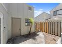 Small backyard featuring a door, gate, and air conditioning unit at 207 Pine Cone Trl, Ormond Beach, FL 32174
