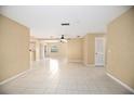 Spacious living area with tile floors, neutral walls, and recessed lighting at 2126 Sabal Palm Dr, Edgewater, FL 32141