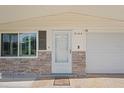 Inviting front entrance with decorative stone detail and well-lit porch at 2144 Brian Ave, South Daytona, FL 32119