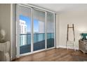 Relaxing balcony with floor-to-ceiling windows and stunning waterfront views, with a glimpse of modern décor at 231 Riverside Dr # 2310, Holly Hill, FL 32117