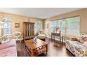Cozy living room with hardwood floors, abundant natural light, and stylish furnishings at 6 Leisure Wood Way, Ormond Beach, FL 32174