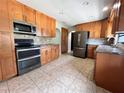The spacious kitchen features stainless steel appliances, granite countertops, and ample cabinet space for storage at 600 S Parkview Ave, Orange City, FL 32763