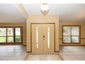 Bright foyer with large windows, tile flooring, and neutral walls, creating an airy and welcoming entrance to the home at 68 Spring Lake Dr, Debary, FL 32713