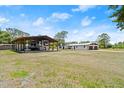 Spacious property featuring a carport, house, and garage at 793 Timothy St, Ormond Beach, FL 32174