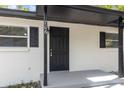 Close-up showcasing the front door and entrance with clean lines, fresh paint, and a welcoming feel at 706 W Franklin Ave, Deland, FL 32720