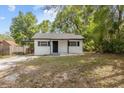 Inviting single-story home with classic details and a neatly landscaped yard, offering a charming curb appeal at 706 W Franklin Ave, Deland, FL 32720