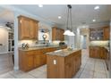 Spacious kitchen with granite countertops, island, and ample cabinetry at 10 Foxhunter Flt, Ormond Beach, FL 32174