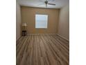 Bedroom with light-colored walls, a ceiling fan and neutral-toned wood-look flooring at 139 Crawl Key Ct, Deland, FL 32720