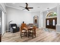 Cozy living area with wood floors, neutral colors, and comfortable seating arrangements at 1523 Red Plum Holw, Deland, FL 32720
