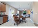 Dining room next to an open-concept kitchen and living area with plenty of natural light at 1929 Cove Point Rd, Port Orange, FL 32128